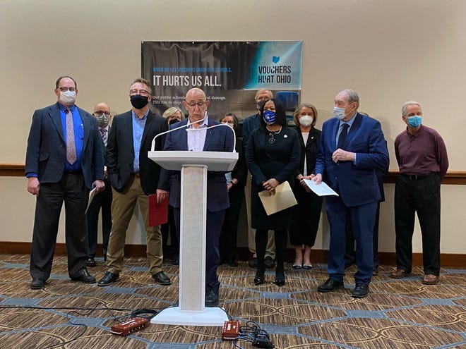 Eric Brown, a school board member for Columbus City Schools, announces a lawsuit challenging the constitutionality of Ohio's EdChoice scholarship programs Tuesday in Columbus.