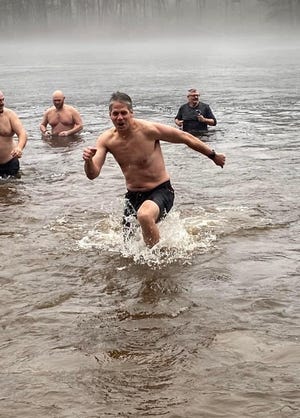 RUTLAND - Ludwig Haber of Rutland was among the approximately 100 hearty souls took the Rutland Tricentennial Polar Plunge on Jan. 1. The New Year's Day run, jump and frolic into chilly Whitehall Pond helped to both ring in 2022 and kick off Rutland's yearlong tricentennial celebration, while benefitting the Atlantic Dippers for Homeless Veterans and Veterans in Need.