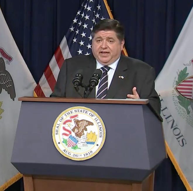 Gov. JB Pritzker provides a COVID-19 update during a news conference Monday in Chicago. Pritzker warned that hospitalizations are as high as they were last winter before vaccines were readily available to the public.