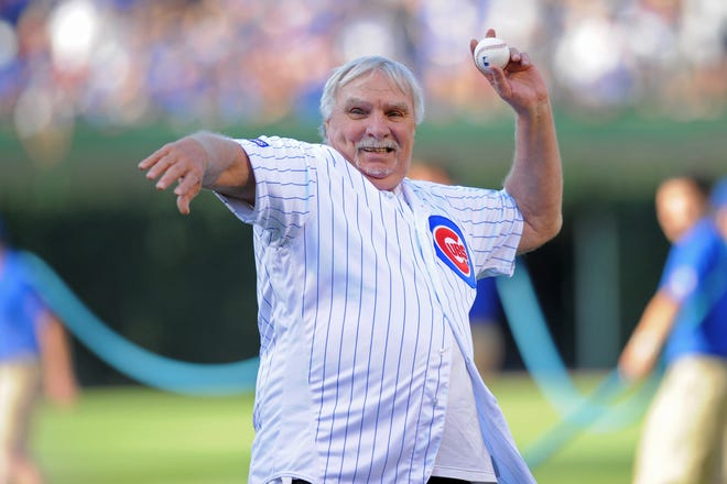 Former Chicago Cubs player Larry Biittner throws out the ceremonial first pitch prior to a 2017 game against the Pittsburgh Pirates at Wrigley Field in Chicago.