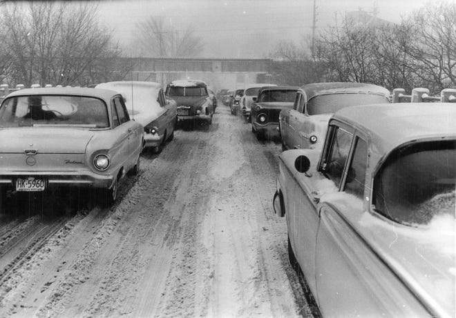 Traffic along Watertown Plank Road slows as the second storm in three days left 7 inches of snow, with more to come, on Jan. 18, 1960. A century earlier, the roadway was a major commercial development for the Milwaukee area, providing a smooth route to Watertown. (This photo was published in the Jan. 18, 1960, Milwaukee Journal.)