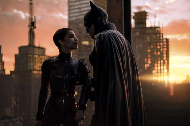 Catwoman (Zoë Kravitz) and Batman (Robert Pattinson) partner up as allies (and love interests) when a serial killer is loose in Gotham City in director Matt Reeves' "The Batman."