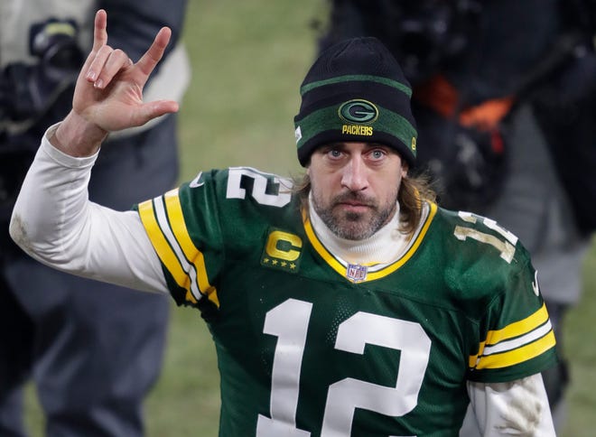 Aaron Rodgers acknowledges the crowd as he leaves the field Sunday after the Packers defeated the Minnesota Vikings, 37-10, at Lambeau Field.