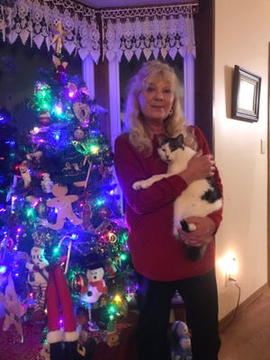 Debbie Auer was reunited with her cat, Kitty, on Dec. 20 two months after he went missing. Auer went out every night and walked the streets of South Milwaukee looking for the furry family member who disappeared Oct. 22.