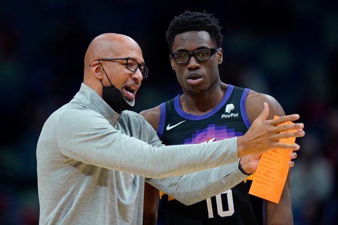 Phoenix Suns head coach Monty Williams talks with forward Jalen Smith (10) in the first half of an NBA basketball game against the New Orleans Pelicans in New Orleans, Tuesday, Jan. 4, 2022.