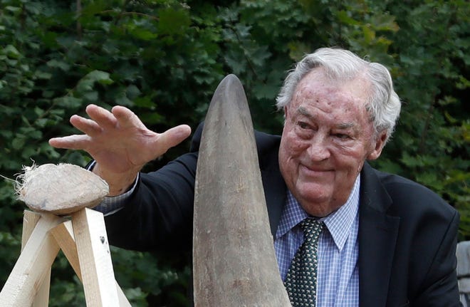 Richard Leakey, Kenyan wildlife conservationist, places a rhino horn to be burned at the zoo in Dvur Kralove, Czech Republic, Tuesday, Sept. 19, 2017. Paleoanthropologist Richard Leakey, known for his fossil-finding and conservation work in his native Kenya, has died at 77. His death was announced Sunday, Jan. 2, 2022 by Kenyan President Uhuru Kenyatta. The cause of death was not announced. 