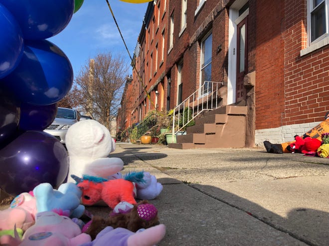 A memorial for the 12 victims of the Philadelphia rowhome fire sits near the site of the blaze in Philadelphia's Fairmount section.