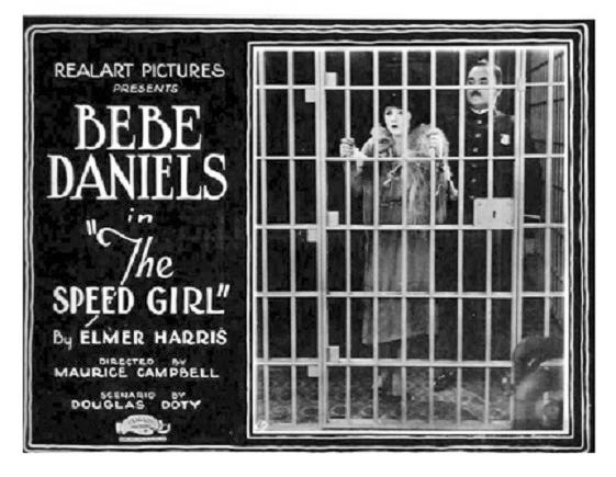 Popular screen actress Bebe Daniels behind bars for going too fast, in the film “Speed Girls,” coming to Charlevoix, January, 1922.