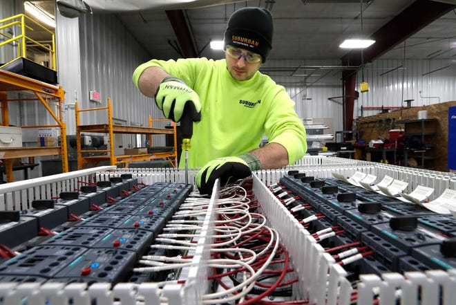 Tyler Huffman builds a control panel Wednesday at the new Suburban Enterprises Fabrication and Automation facility at 3040 N. Pointer Road in Appleton.