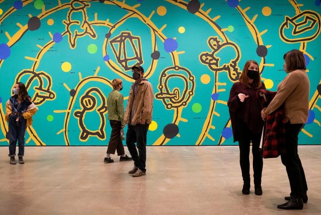 “Connection and/or Separation” by Bing Lee is the largest work, a 45-by-16-foot mural, on display.