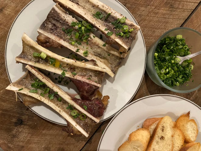 Marrow bones with toasted baguette and simple parsley salad.