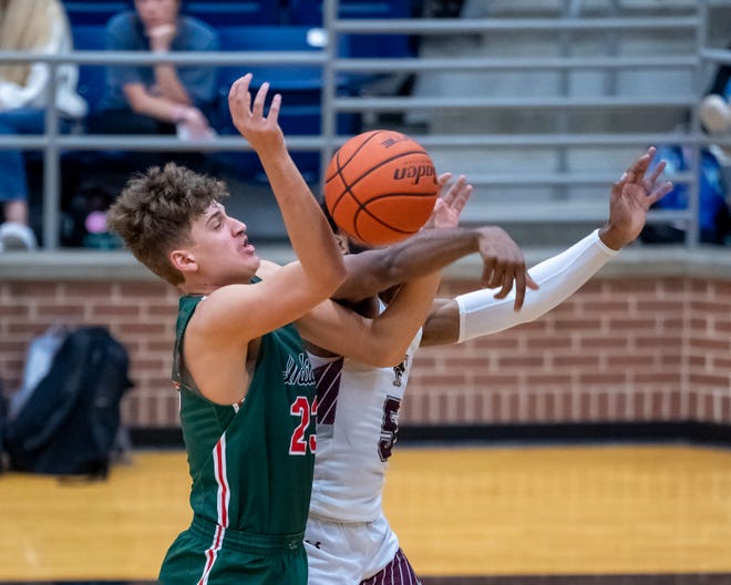 Waxahachie freshman Parker Jefferson (23) goes after a loose ball during a game against Mansfield Timberview.