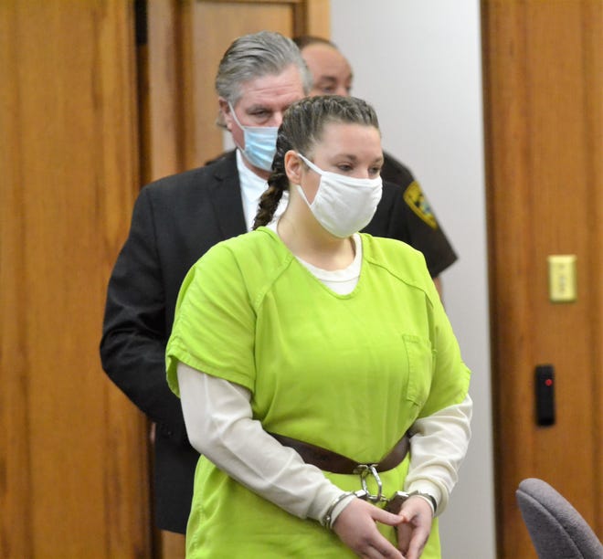 Alicia Kocken, 34, of Oconto Falls, enters Oconto County Circuit Court on Friday, Jan. 7, 2022, for her preliminary hearing on charges related to shooting of Oconto Falls Police officer Nicole Blaskowski on Aug. 6, 2021. Behind her is her attorney, John Miller Carroll.
