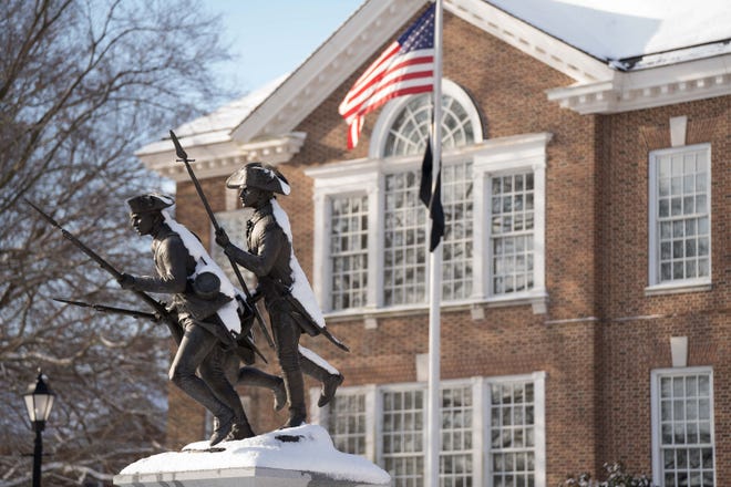 The Delaware Continentals statue is covered in a dusting of snow in front of Legislative Hall in Dover around 9:30 a.m., on Delaware’s second snow day of the year on Friday, Jan. 7, 2022.