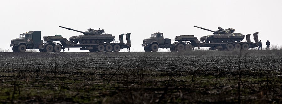 Ukrainian tanks are transported to the Luhansk region, Ukraine, on Dec. 12, 2021.