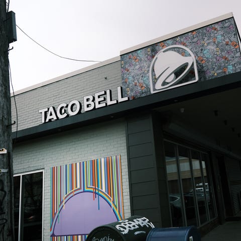 A Taco Bell restaurant stands along a Queens stree