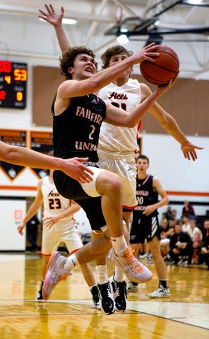 Fairfield Union's Brennen Rowles (2) charges the lane through and goes for the lay up against the Amanda-Clearcreek defense as Amanda-Clearcreek hosted Fairfield Union in boys basketball action at Amanda-Clearcreek High School in Amanda, Ohio on January 7, 2022.