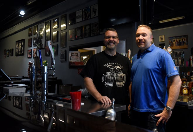Samuel Smith and Dustin Polage, owners of Franks and Sammies, opened Tap That Glass taproom on Friday next to their existing business on South Third Street in Newark.