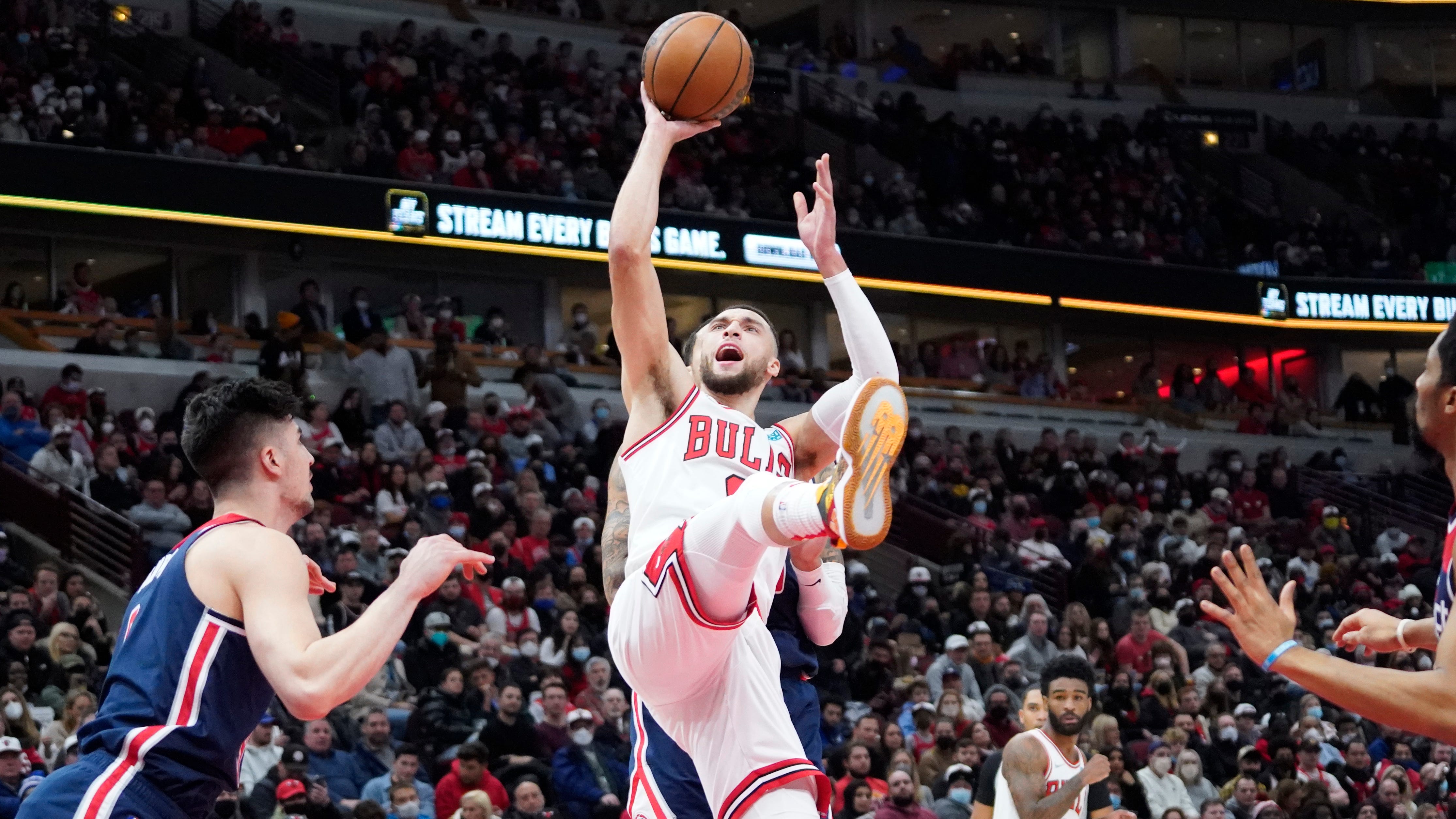 Jan. 7: Bulls guard Zach LaVine drives and puts up the off-balance shot in the lane against the Wizards.