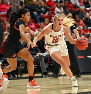 Texas Tech's Bryn Gerlich (10) pushes past an Oklahoma State defender at the game Saturday, Jan. 8, 2022, at United Supermarkets Arena in Lubbock.