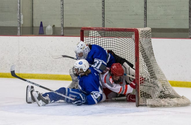 Gibraltar Carlson’s Jake Marcott and a Grosse Ile player wind up in the net along with Carlson goalkeeper Isaac Kolasa during the finals of the Woodhaven Tournament Saturday. The Marauders fell 1-0. [Photo courtesy of STEPHANIE HAWKINS]