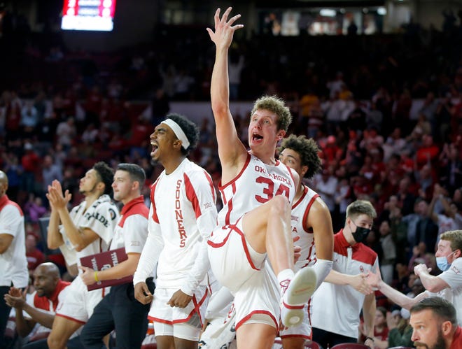 Oklahoma forward Jacob Groves, center, celebrates during the Sooners' 79-66 win over Iowa State on Saturday at Lloyd Noble Center in Norman, Okla. The Sooners will face Texas on Tuesday.
