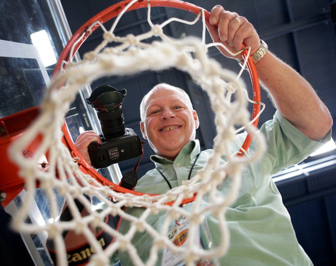 Repository staff photographer Scott Heckel is shown at the James A. Rhodes Arena on the campus of the University of Akron.
