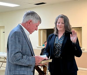 Sylvania mayor Preston Dees swears in Laura Mills to the Sylvania City Council on Jan. 4.