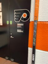 The hockey stick Flyers' Cam Atkinson signed with Teddy Balkind's initials, "TB,” as part of a tradition to honor fallen hockey players.