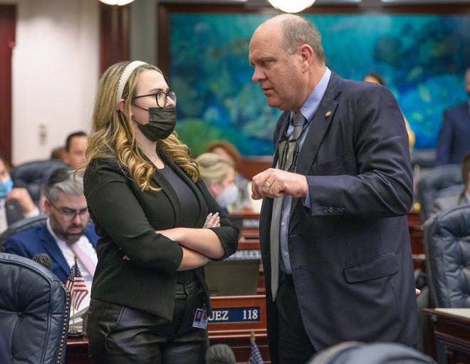 Rep. Josie Tomkow, R-Polk City, and Rep. Keith Truenow, R-Mount Dora, confer on the House floor on April 1, 2021.