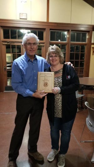 Nichole Engelhardt, seen here receiving the Story City Lions Community Service Award from Lion LeRoy Kester, was recognized for her many contributions to the City of Story City at a banquet on Nov. 18. The Lions Community Service Award is presented annually to a worthy recipient with an extended history of volunteering and assisting with community efforts.