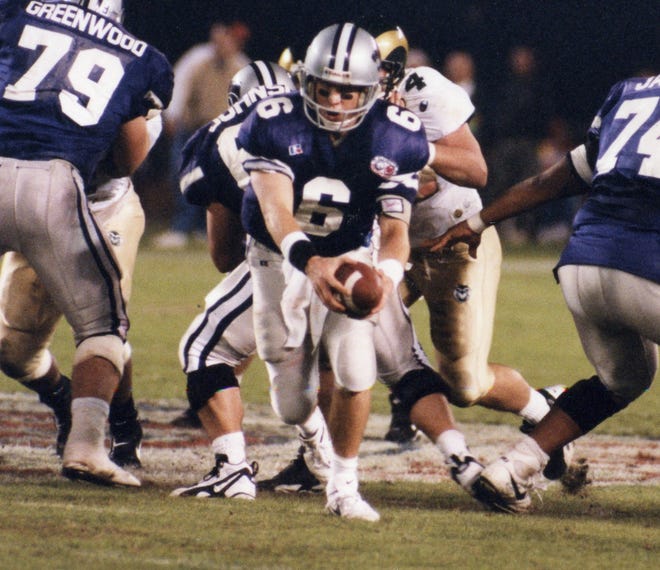 Former Kansas State quarterback Matt Miller (6) looks to hand off during his senior year in 1995. Miller died Saturday after an 18-month battle with prostate cancer.