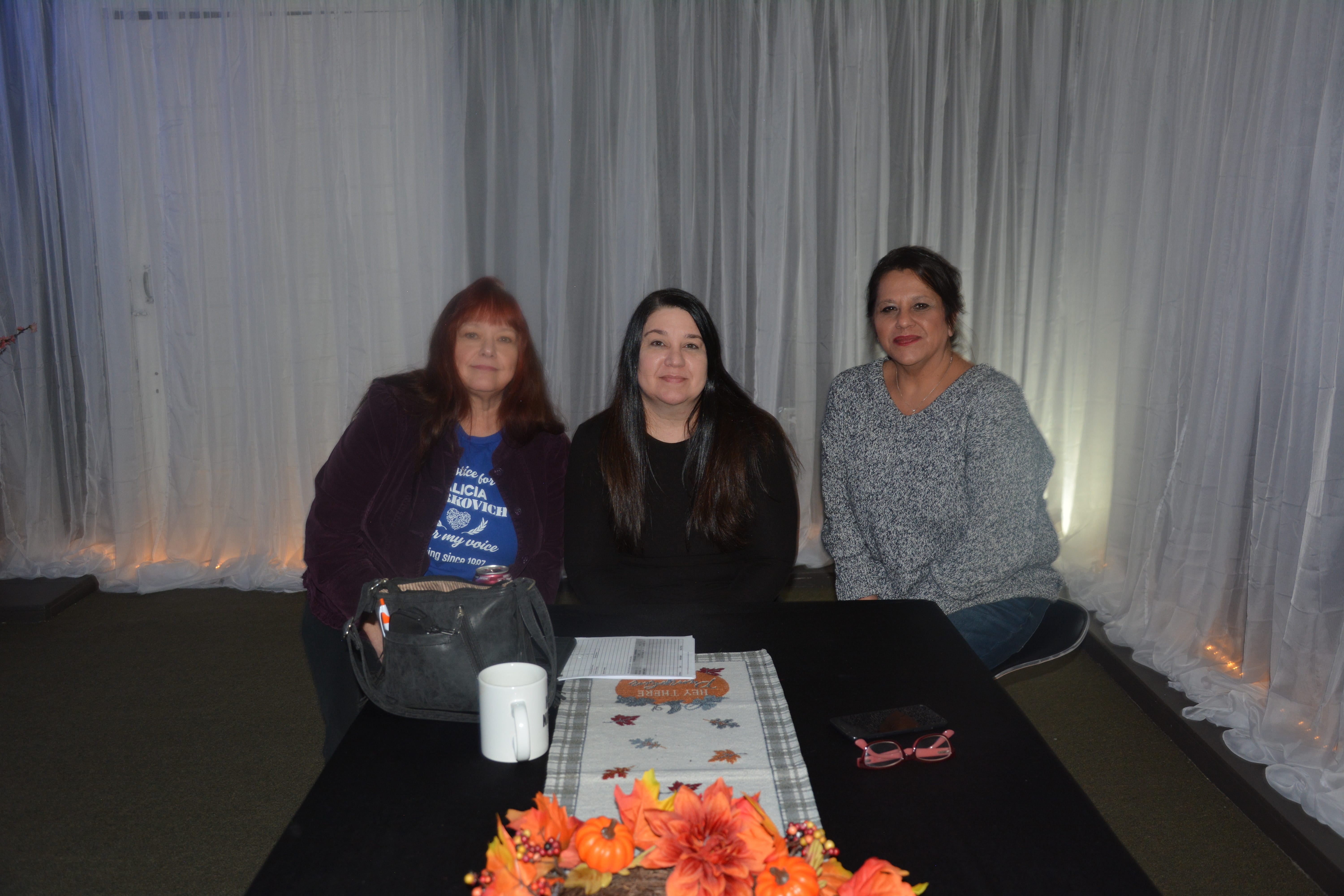 From left: Marcie Vitko, the mother of Alicia Markovich, sits with friends Leah Altemus and Chrissie Boyer at Black Raven Metaphysical Shoppe & Reiki Salon in Windber.