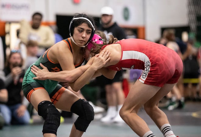 Wrestlers competed at the Panhandle Championships held at Mosley High School Friday, January 7, 2022. Valarie Solorio, from Mosley, tangles with Jake Parker, from Wewahitchka, in the 106 pound class.