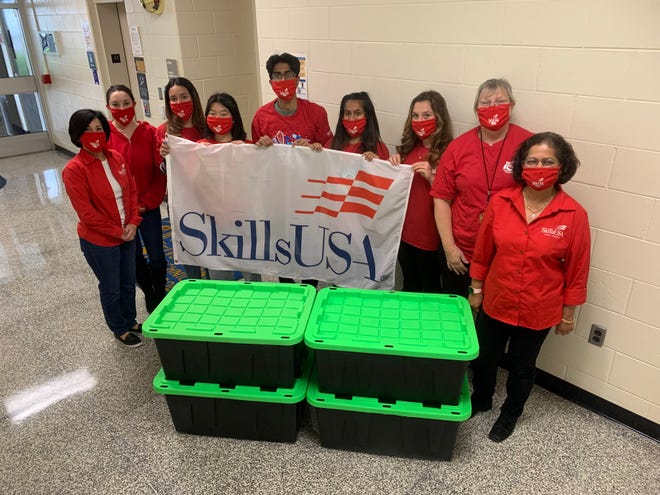 (Left to right) SCVTHS SkillsUSA Advisor Michelle Fresco, SCVTHS SkillsUSA Advisor Sam Inga, SCVTHS students Emily Rosalli of Hillsborough, Grace Chen of Hillsborough, Pranav Potrevu of Basking Ridge, Jiya Mody of Martinsville, Reilly Sibilia of Raritan and SCVTHS SkillsUSA Advisors Karen Morlock and Pratima Patil pose for a photo with some of the “baskets” created from the food drive.