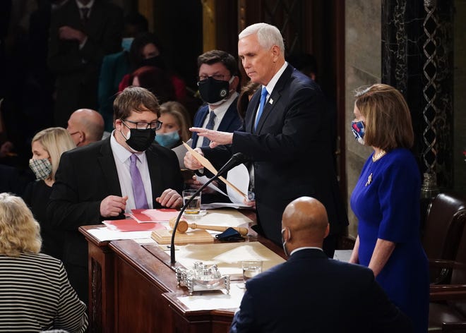 Vice President Mike Pence and House Speaker Nancy Pelosi preside over the certification of Electoral College votes at the Capitol on Jan. 6, 2021.