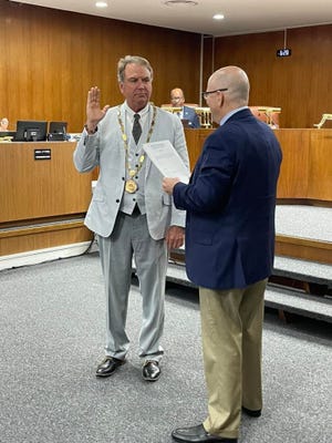 Mayor Brad Dantzler was sworn in as a commissioner for another term and reelected as mayor for an additional one-year term Monday night.