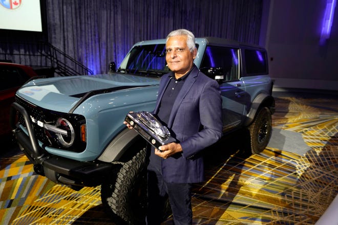 Kumar Galhotra, Ford President of the Americas and International markets group poses next to the Bronco off-road SUV in Detroit. The Bronco off-road SUV earned the utility of the year.
