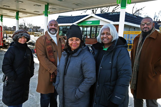New BP gas station owner Kai Trimble-Lea, center, is photographed with Northwest Side Community Development Corporation Renata Bunger, left, Willie Smith, previous owner Diane Stower, to the right of Trimble-Lea, and Raymond Monk, far right, on Tuesday, Jan. 11, 2022 at Trimble-Lea's business at 807 W. Atkinson Ave. in Milwaukee.