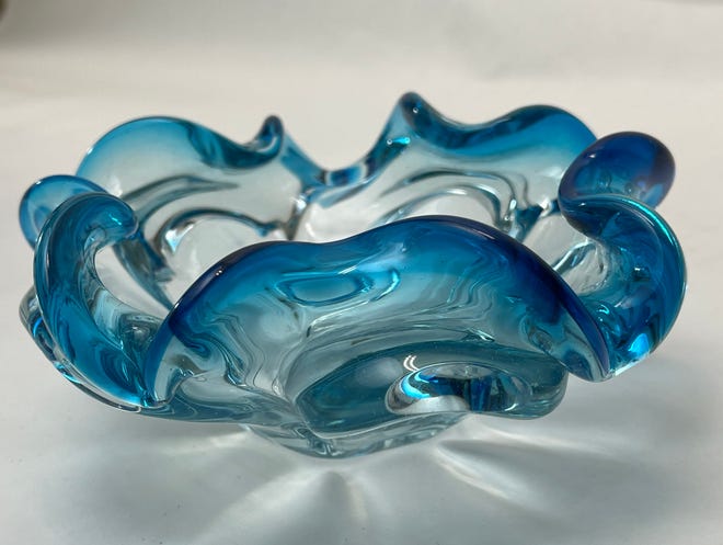 Multiple hues, flowing designs and internal bubbles are characteristic of Murano glass ($34).