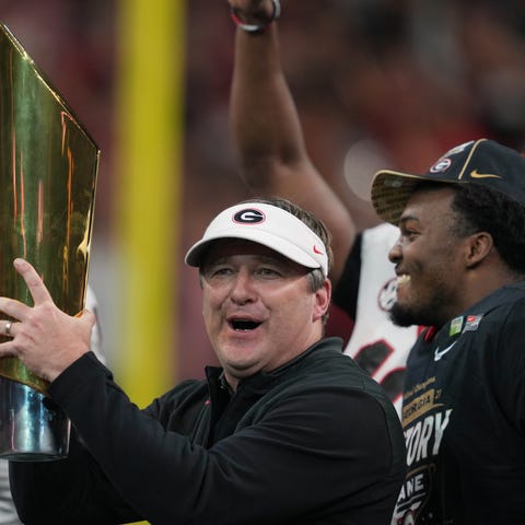 Georgia Bulldogs head coach Kirby Smart holds the 