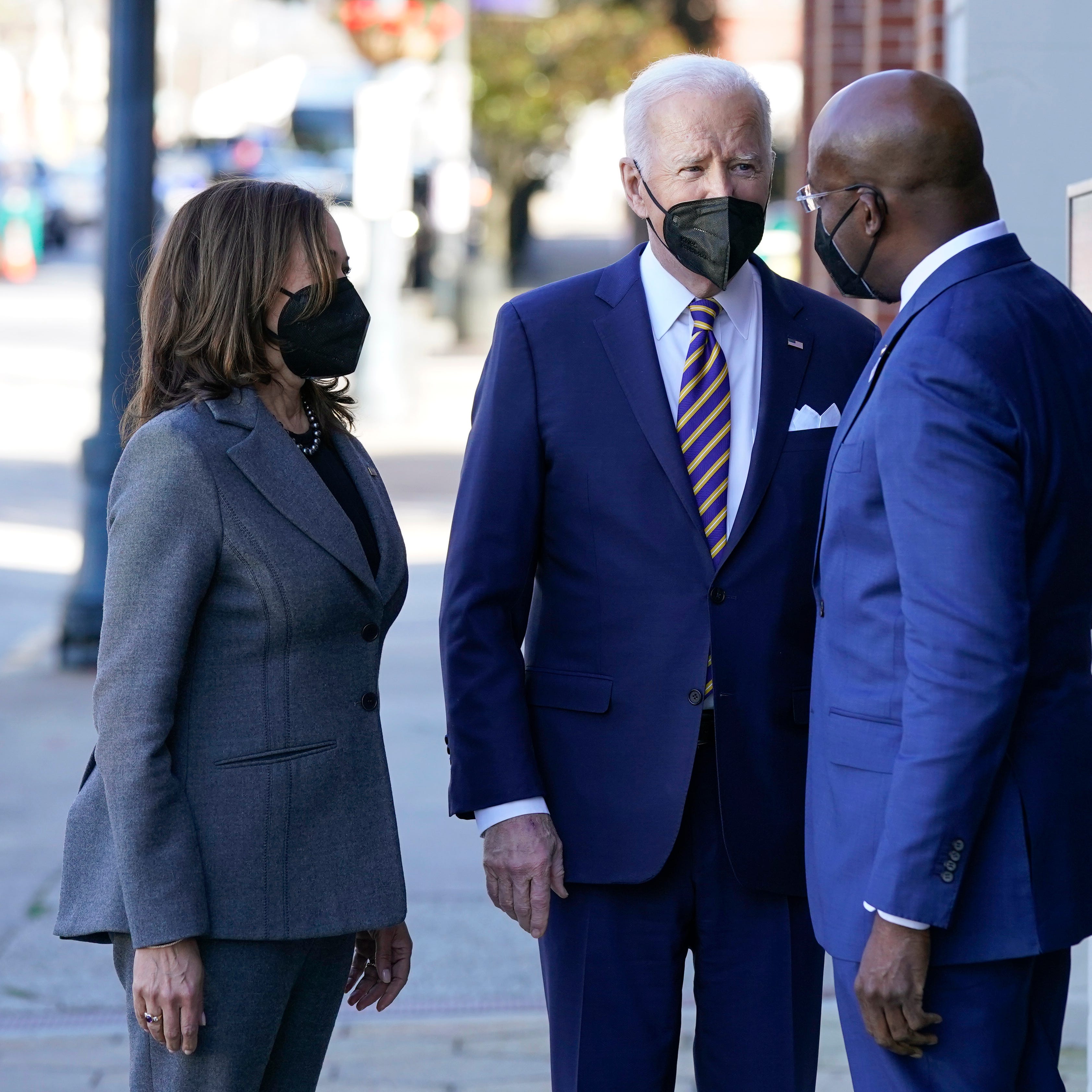 President Joe Biden and Vice President Kamala Harris greet Sen. Raphael Warnock, D-Ga., as they arrive for a visit to Ebenezer Baptist Church, Tuesday, Jan. 11, 2022, in Atlanta.
