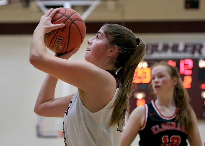 Buhler's Abby Yutzy (25) shoots the ball against El Dorado's Gibby Baker (10) during their game Tuesday, Jan. 11, 2022. Yutzy was the team's leading scorer with 16 points as Buhler defeated El Dorado 53-22.