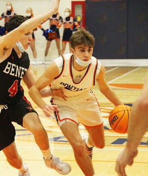 Pontiac's Kerr Bauman, shown here during Pontiac Holiday Tournament action against Benet Academy, scored 24 points Tuesday to lead the Indians to a 69-60 victory over Morris. It was Pontiac's fourth straight win.
