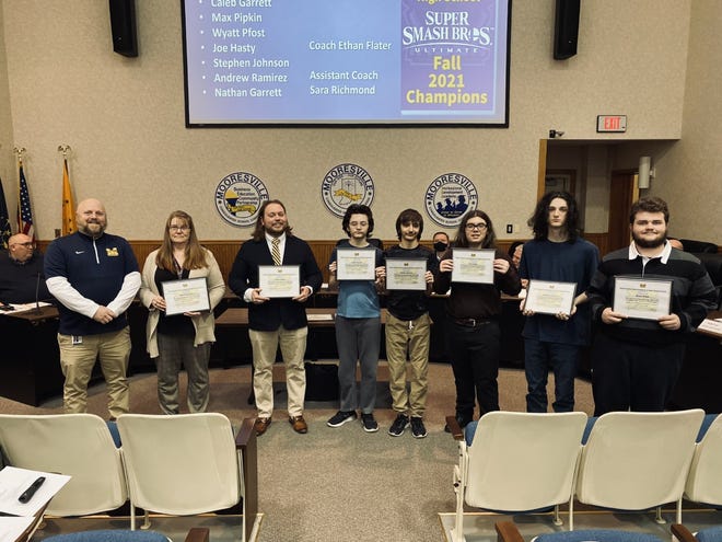 The eSports team, with principal Wes Upton (far left), assistant coach Sara richmond (second from left) and coach Ethan Flater (third from left). Stephen Johnson (second from right) is the only senior on the team.