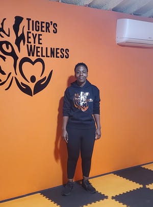 Pictured, Jekera Holmes is the owner of Tiger's Eye Wellness in New Bern