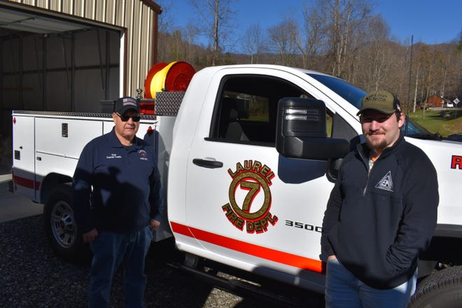 Laurel Volunteer Fire Department Chief Emerson Franklin, left, and assistant chief Dillon Cantrell pose in front of the department's new utility truck it received Dec. 31.