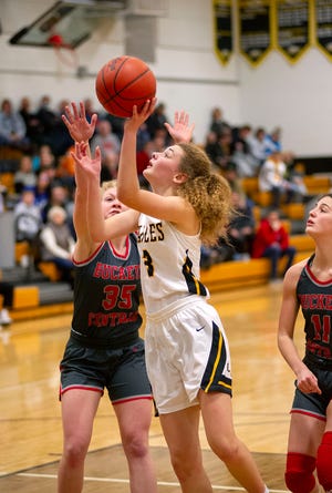 Colonel Crawford's Mallory Plesac finishes at the basket.