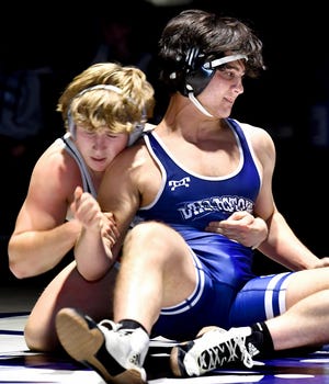 Dallastown's Michael Klinger and South Western's Owen Reed, left, grapple during their their 189-pound bout during a match at Dallastown Tuesday, Jan. 11, 2022. Reed won the bout 7-5. Bill Kalina photo  