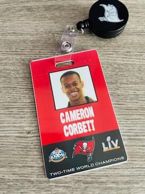 Cameron Corbett, of Magnolia, shows off his official Tampa Bay Buccaneers ID received during his internship as an athletic trainer with the team in the summer of 2021.